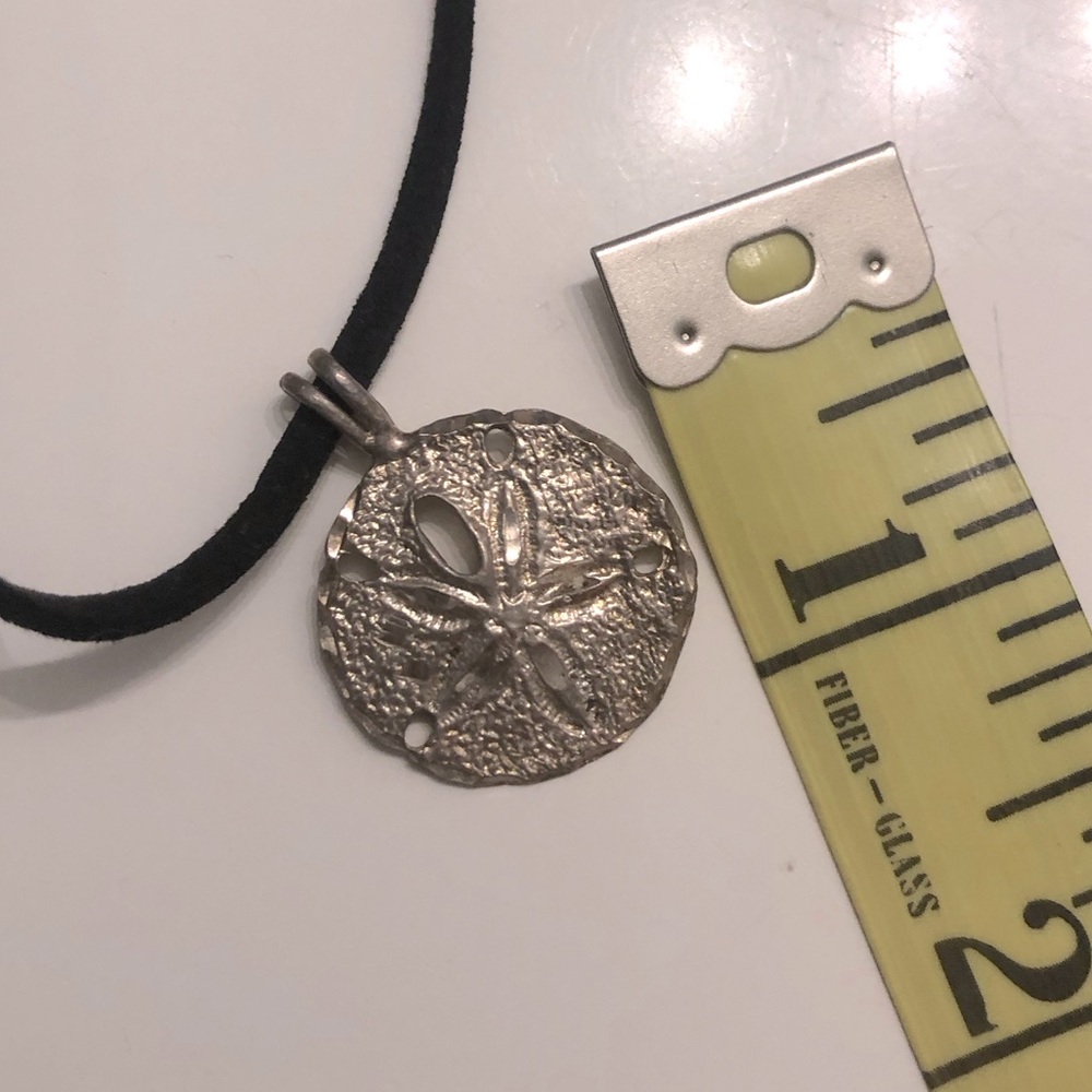 Silver vintage sterling sand dollar pendant